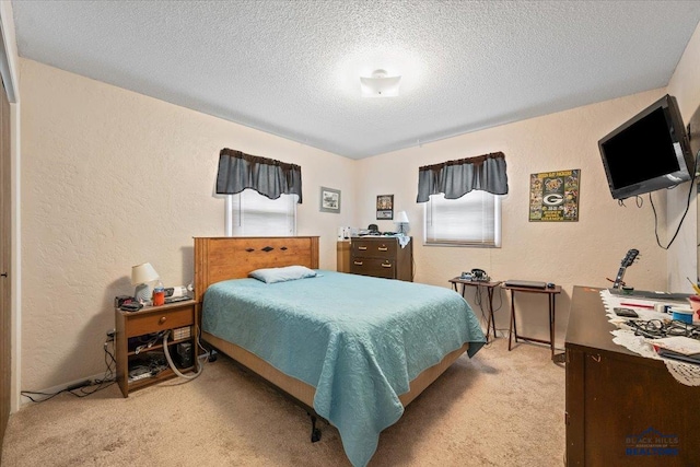720 S 32nd, Spearfish, SD 57783 - bedroom featuring light carpet, a textured wall, and a textured ceiling