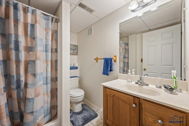 720 S 32nd, Spearfish, SD 57783 - full bathroom featuring a paneled ceiling, toilet, a shower with shower curtain, vanity, and tile patterned flooring