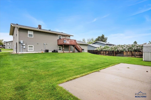 720 S 32nd, Spearfish, SD 57783 - back of house with stairway, a deck, a patio, a chimney, and cooling unit