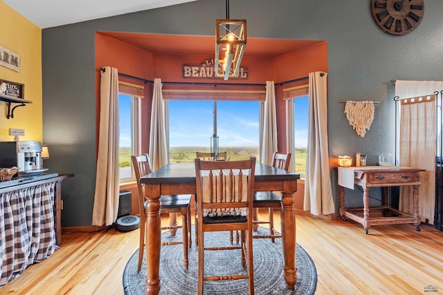 22841 Gateway Dr, Box Elder, SD 57719 - dining room featuring light wood-style flooring, healthy amount of natural light, and baseboards