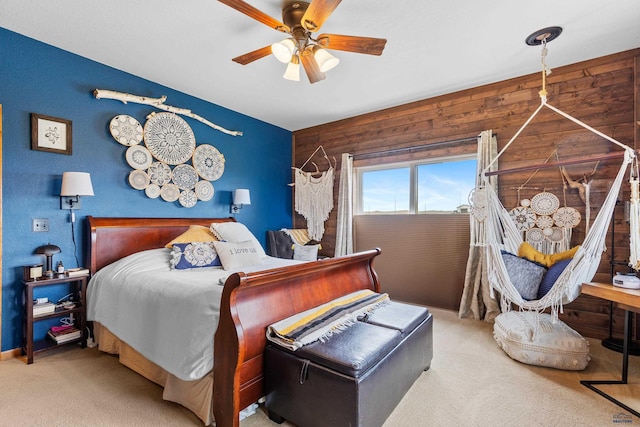 22841 Gateway Dr, Box Elder, SD 57719 - bedroom featuring carpet floors, wood walls, and ceiling fan