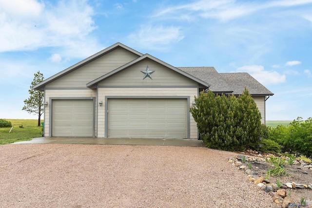 22841 Gateway Dr, Box Elder, SD 57719 - ranch-style home featuring driveway, a shingled roof, and an attached garage