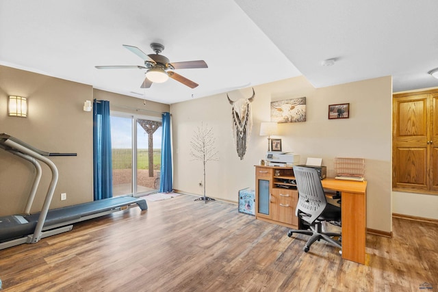 22841 Gateway Dr, Box Elder, SD 57719 - office area with wood finished floors, a ceiling fan, and baseboards