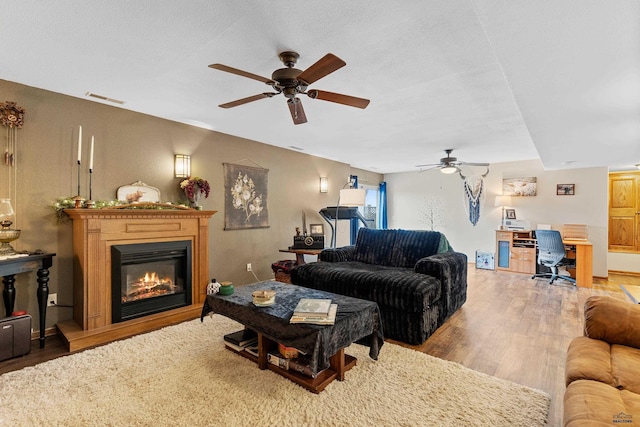 22841 Gateway Dr, Box Elder, SD 57719 - living room with ceiling fan, wood finished floors, and an office area