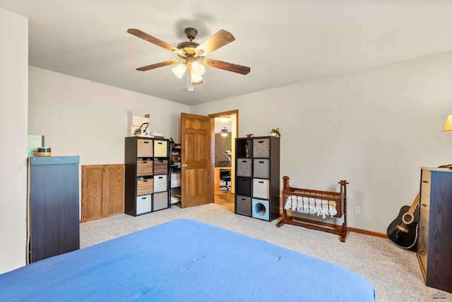 22841 Gateway Dr, Box Elder, SD 57719 - bedroom featuring light carpet, a ceiling fan, and baseboards