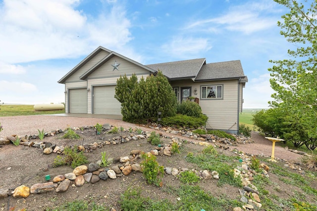 22841 Gateway Dr, Box Elder, SD 57719 - ranch-style house with an attached garage, driveway, and roof with shingles