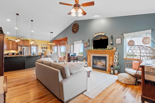 22841 Gateway Dr, Box Elder, SD 57719 - living room featuring healthy amount of natural light, light wood-type flooring, a ceiling fan, recessed lighting, and high vaulted ceiling