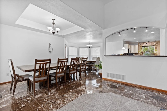 6401 Mountain Meadow Rd, Black Hawk, SD 57718 - dining room with a chandelier, marble tiled floors, and baseboards