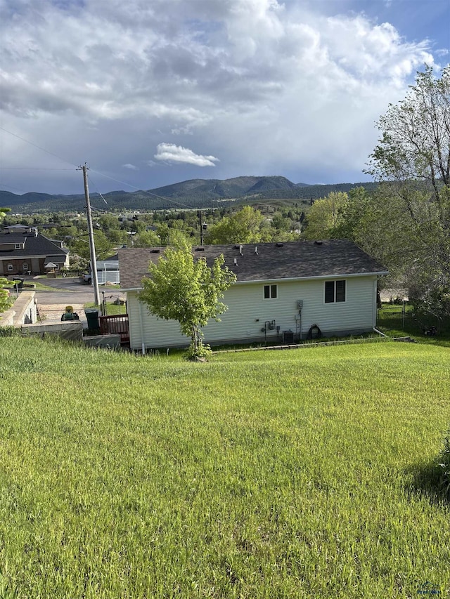 1523 Hope St, Sturgis, SD 57785 - view of side of home featuring a mountain view and a yard