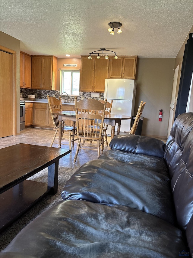 1523 Hope St, Sturgis, SD 57785 - living area featuring a textured ceiling