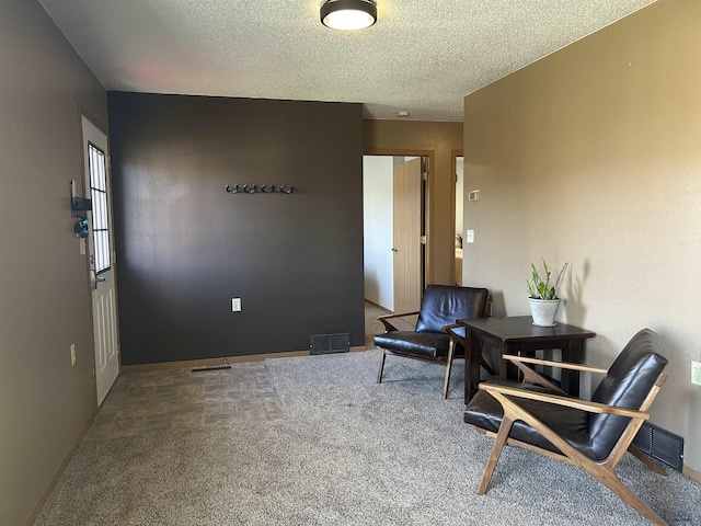 1523 Hope St, Sturgis, SD 57785 - living area featuring carpet, a textured ceiling, and baseboards
