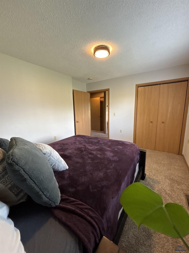 1523 Hope St, Sturgis, SD 57785 - bedroom featuring a closet, carpet, and a textured ceiling