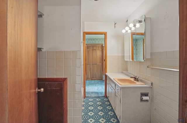 12384 Stannum Pl, Hill City, SD 57745 - bathroom with tile walls, a wainscoted wall, and vanity