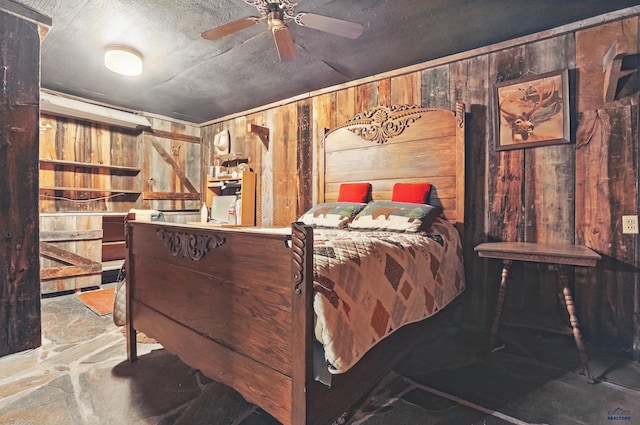 12384 Stannum Pl, Hill City, SD 57745 - bedroom with wood walls and stone floors