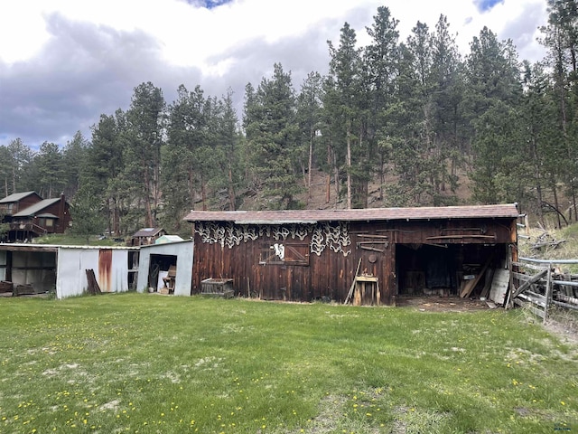 12384 Stannum Pl, Hill City, SD 57745 - view of outbuilding with a wooded view