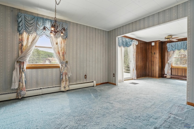 12384 Stannum Pl, Hill City, SD 57745 - carpeted spare room with wallpapered walls, a chandelier, baseboard heating, and ceiling fan