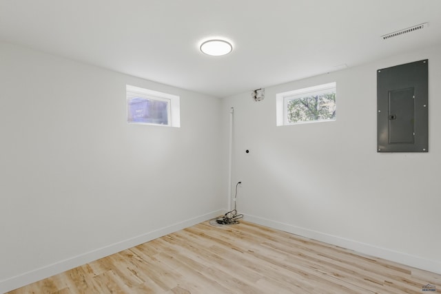 726 Willsie Ave, Rapid City, SD 57701 - below grade area with electric panel, wood finished floors, and baseboards
