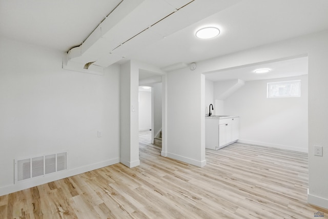 726 Willsie Ave, Rapid City, SD 57701 - basement with light wood-style floors, a sink, and baseboards