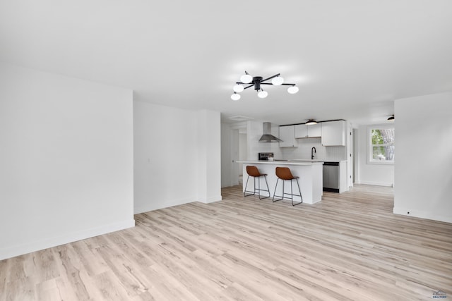 726 Willsie Ave, Rapid City, SD 57701 - unfurnished living room with light wood-style floors, a sink, and baseboards