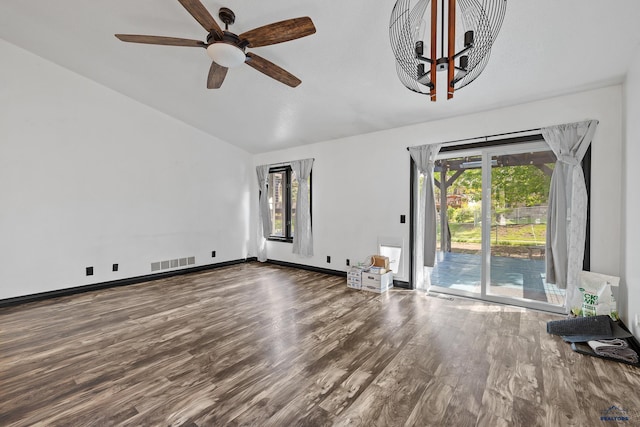 1215 Range View Cir, Rapid City, SD 57701 - unfurnished living room with lofted ceiling, wood finished floors, healthy amount of natural light, a ceiling fan, and baseboards