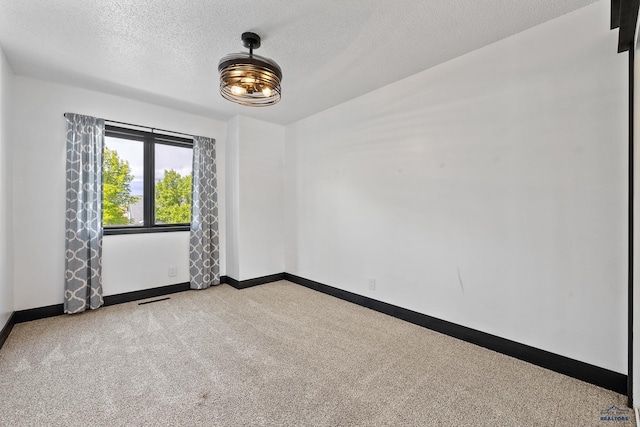 1215 Range View Cir, Rapid City, SD 57701 - spare room with carpet, baseboards, and a textured ceiling