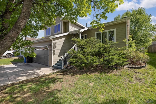 1215 Range View Cir, Rapid City, SD 57701 - view of front of house with driveway, a garage, and a front yard