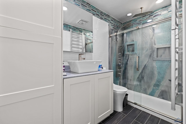 1215 Range View Cir, Rapid City, SD 57701 - full bath featuring vanity, a shower stall, toilet, and recessed lighting