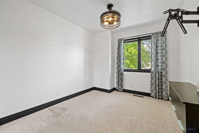 1215 Range View Cir, Rapid City, SD 57701 - unfurnished room featuring carpet, a textured ceiling, and baseboards