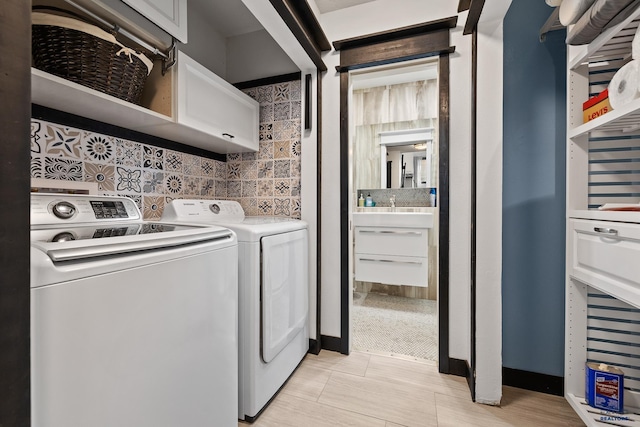 1215 Range View Cir, Rapid City, SD 57701 - laundry room featuring cabinet space and separate washer and dryer