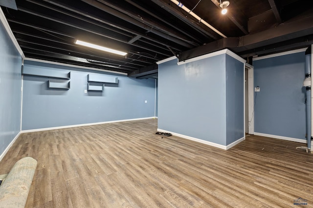 1215 Range View Cir, Rapid City, SD 57701 - finished basement with baseboards and wood finished floors