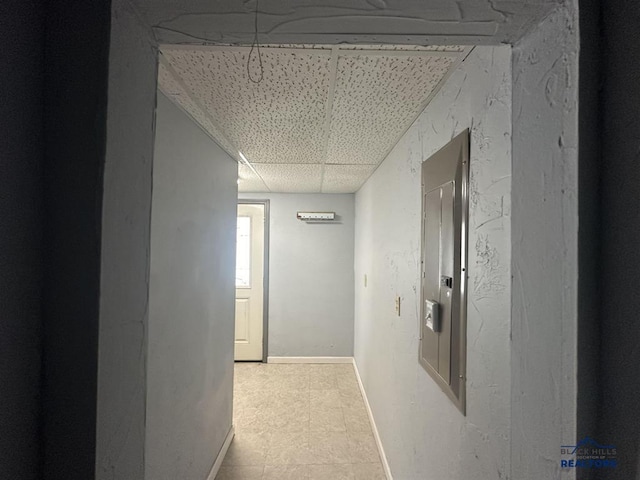 414 2nd Ave, Edgemont, SD 57735 - corridor featuring a paneled ceiling and baseboards