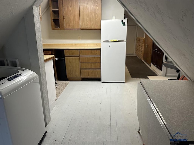 414 2nd Ave, Edgemont, SD 57735 - additional living space with washer / clothes dryer, light wood-type flooring, and vaulted ceiling
