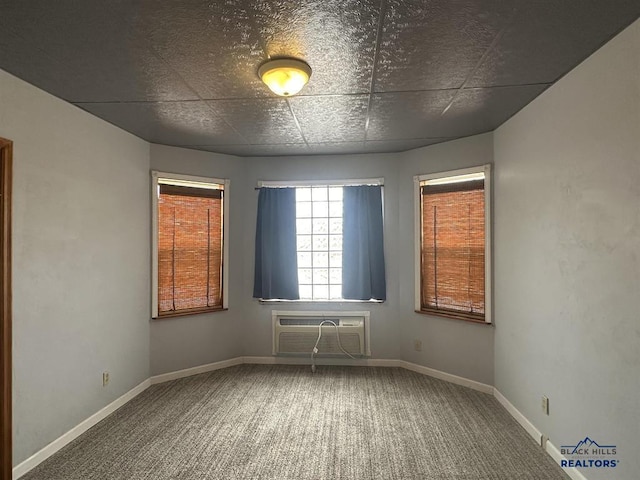 414 2nd Ave, Edgemont, SD 57735 - spare room with a wall mounted AC, carpet flooring, and baseboards
