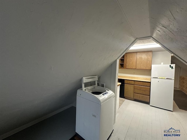 414 2nd Ave, Edgemont, SD 57735 - washroom with washer / clothes dryer and light wood-type flooring