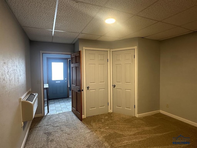 414 2nd Ave, Edgemont, SD 57735 - corridor with carpet, a drop ceiling, baseboards, and a wall mounted air conditioner