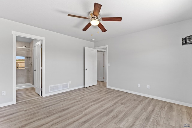 416 Henry Potter Rd, Box Elder, SD 57719 - unfurnished bedroom featuring light wood-style flooring, baseboards, ceiling fan, and ensuite bathroom
