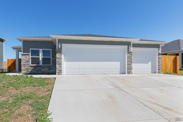 416 Henry Potter Rd, Box Elder, SD 57719 - view of front of house with a garage, driveway, and stone siding