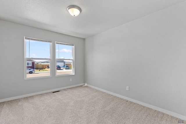 416 Henry Potter Rd, Box Elder, SD 57719 - empty room with baseboards, carpet, and a textured ceiling