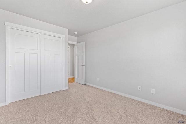 416 Henry Potter Rd, Box Elder, SD 57719 - unfurnished bedroom with carpet floors, baseboards, and a closet