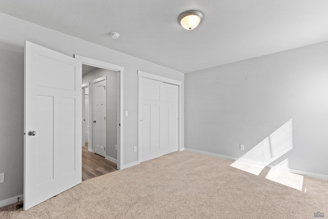 416 Henry Potter Rd, Box Elder, SD 57719 - unfurnished bedroom with carpet floors, a closet, and baseboards