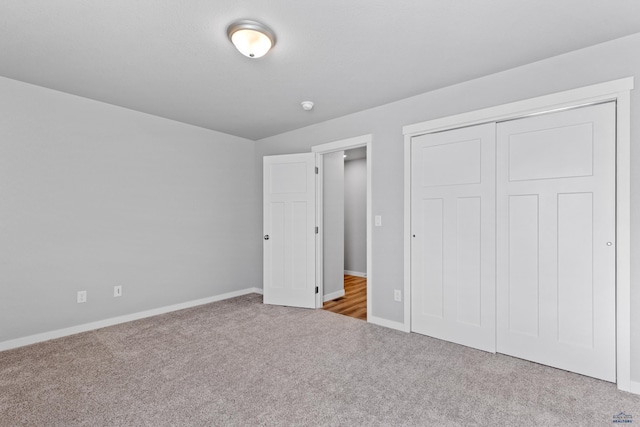 416 Henry Potter Rd, Box Elder, SD 57719 - unfurnished bedroom with carpet, baseboards, and a closet