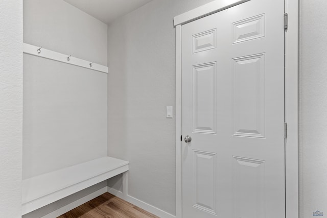 416 Henry Potter Rd, Box Elder, SD 57719 - mudroom with baseboards and wood finished floors