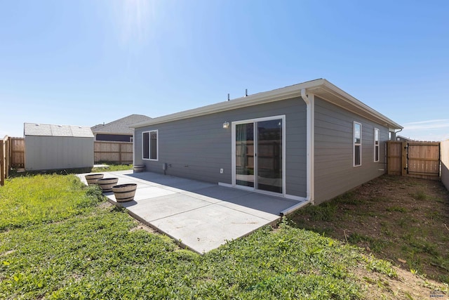416 Henry Potter Rd, Box Elder, SD 57719 - rear view of house with a patio, a fenced backyard, and a gate