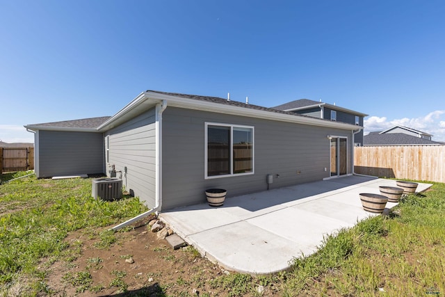 416 Henry Potter Rd, Box Elder, SD 57719 - rear view of house with a patio and central AC
