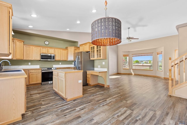 4300 Donegal Way, Rapid City, SD 57702 - kitchen with appliances with stainless steel finishes, light brown cabinetry, a sink, a kitchen island, and ceiling fan