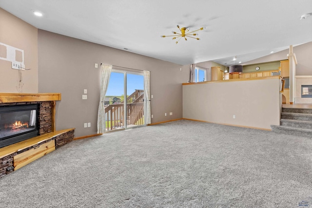 4300 Donegal Way, Rapid City, SD 57702 - unfurnished living room featuring a fireplace, carpet floors, baseboards, stairs, and vaulted ceiling