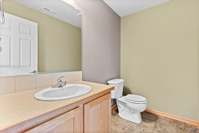 4300 Donegal Way, Rapid City, SD 57702 - half bath with toilet, vanity, baseboards, and backsplash