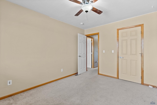 4300 Donegal Way, Rapid City, SD 57702 - unfurnished bedroom featuring baseboards, light colored carpet, and a ceiling fan
