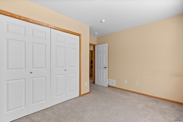 4300 Donegal Way, Rapid City, SD 57702 - unfurnished bedroom featuring light carpet, baseboards, and a closet