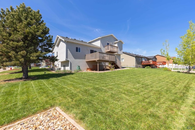 4300 Donegal Way, Rapid City, SD 57702 - rear view of house featuring a deck, a lawn, and stairs